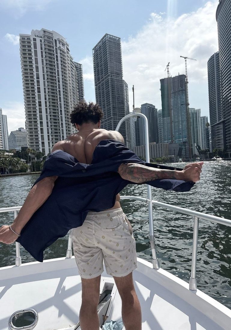 The original photo of a man on a boat in Miami